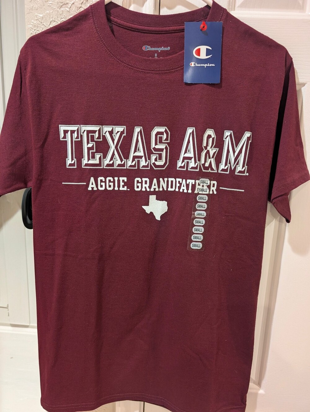 An Official Texas A&M "AGGIE GRANDFATHER" Maroon  By Champion Tee Shirt